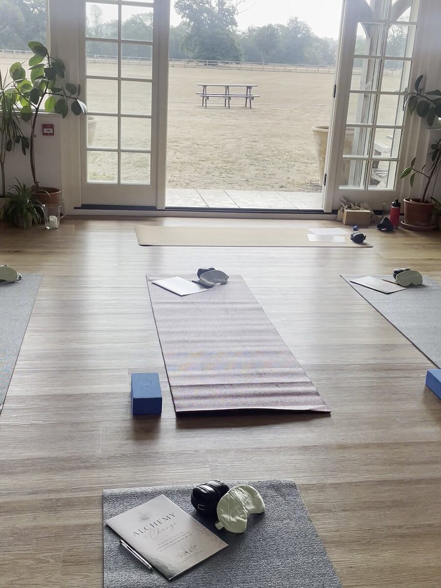 The studio set for a retreat, French doors open onto a field